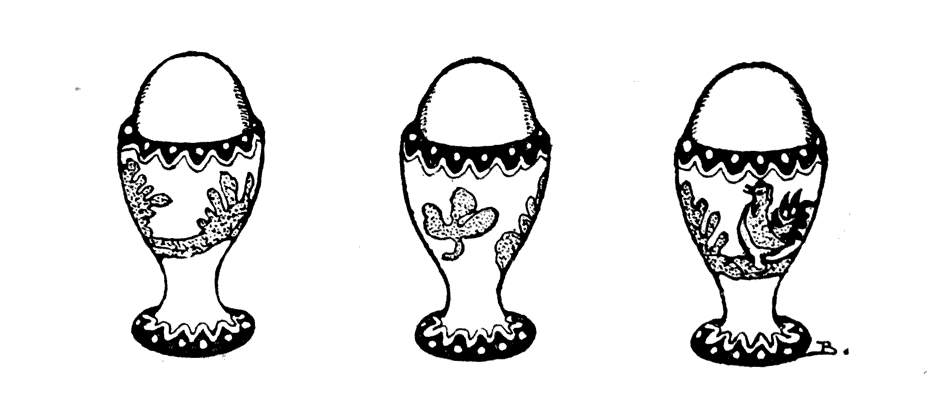 three eggs in decorated cups